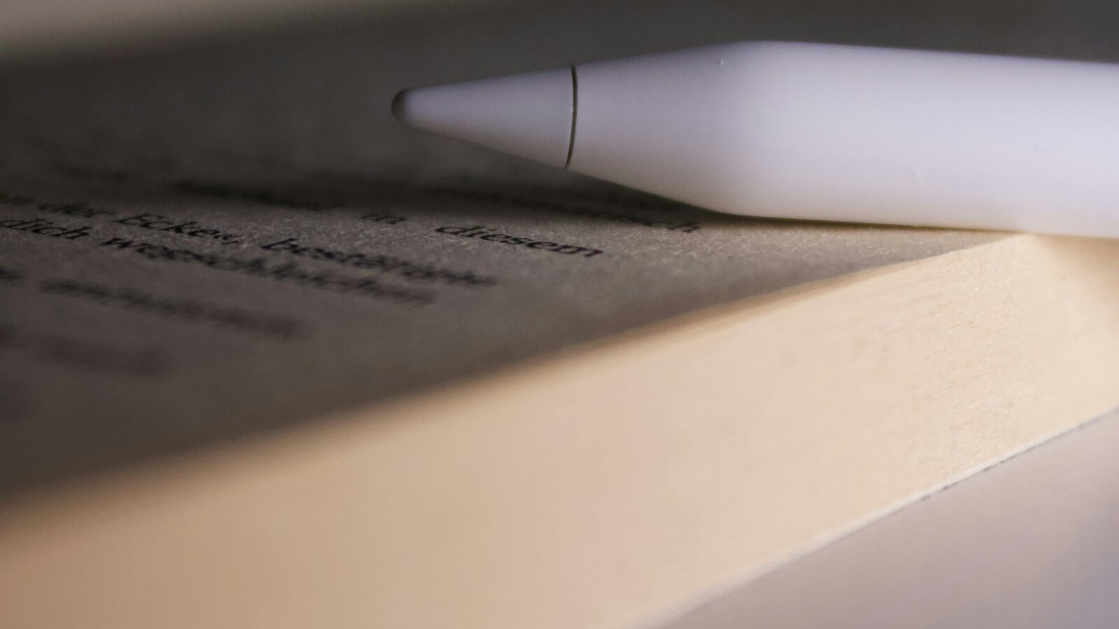 A notebook and coffee on a table in soft light