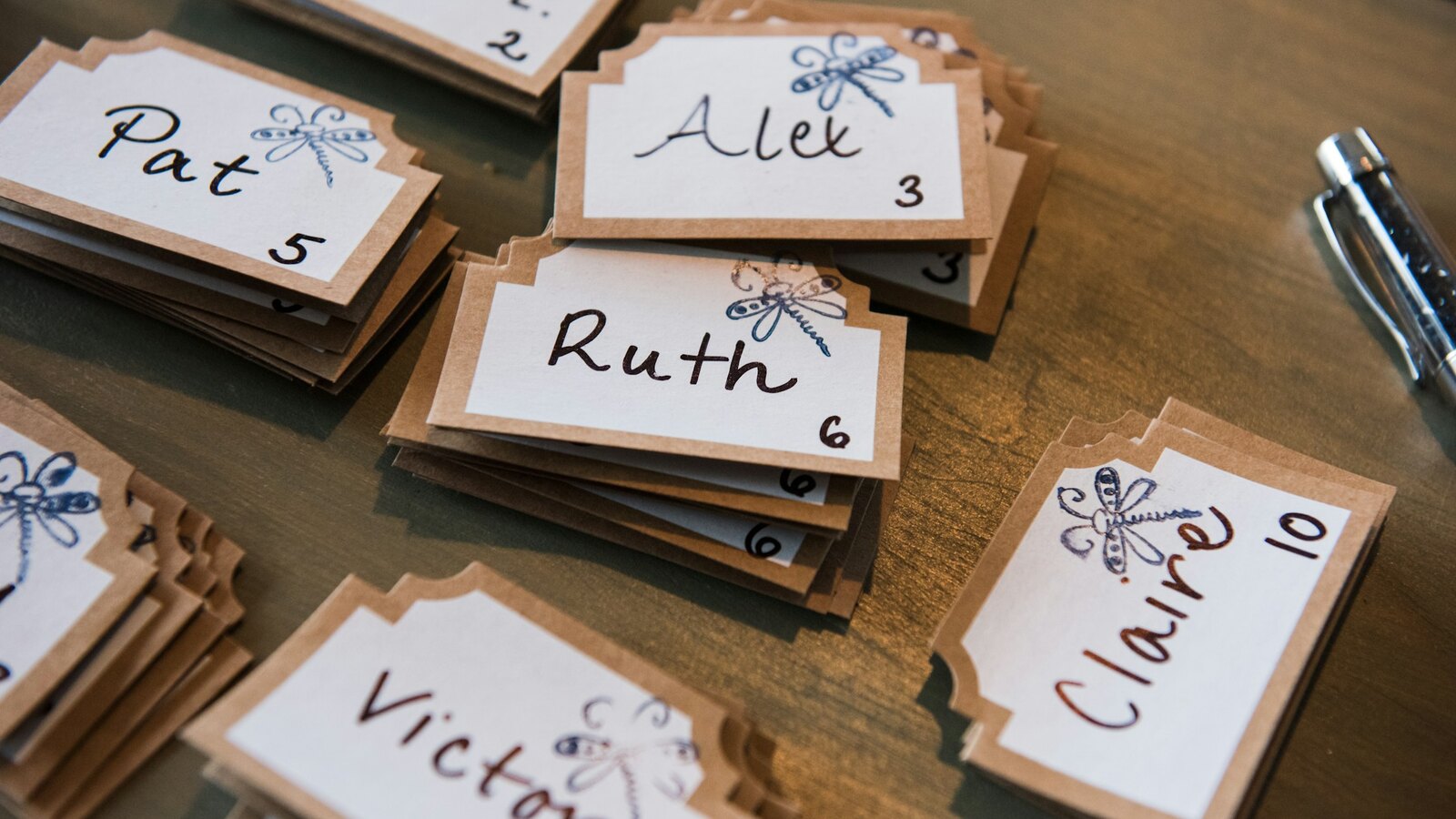 Handwritten place cards and stationery details